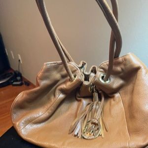 Michael Kors luggage color cinched top bag.